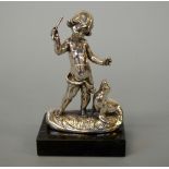 A CONTINENTAL SILVER FIGURE OF A BOY AND SEAL, on plinth, height approximately 14.5cm