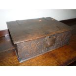 A COUNTRY OAK BIBLE BOX, with carved fleur de lys front panel, iron hinges and lock plate,