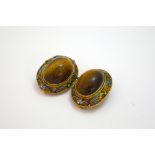 A PAIR OF ENAMELLED FILIGREE TIGERS EYE CLIP EARRINGS, with central oval cabochon tigers eye