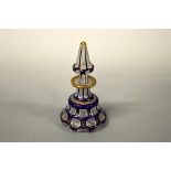 A BOHEMIAN STYLE OVERLAID SCENT BOTTLE AND STOPPER, blue and gilt painted decoration, chips to rim