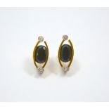 A PAIR OF 18CT GOLD TOURMALINE AND DIAMOND EARRINGS, of bi-colour abstract design, the central