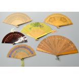 FOUR BOXED SOUVENIR FANS, to include pierced and coloured fabric design and two others (6)