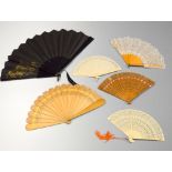 A COLLECTION OF SIX FANS, to include four pierced examples, one lace and one fabric