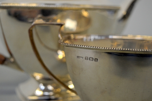 A TWO PIECE SILVER TEASET, Birmingham 1920, approximately weight 875g includes wooden handle and - Image 3 of 3