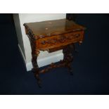 A VICTORIAN WALNUT WORK/SEWING TABLE, the lift up top revealing mirror and lift-out tray with