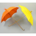 TWO LADIES SILK PARASOLS, the orange example with ribbon detail, the yellow with beaded decoration