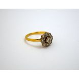 A DIAMOND CLUSTER RING, with central brilliant-cut diamond within a surround of smaller brilliant-