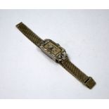 A LADIES DIAMOND ART DECO COCKTAIL WATCH, with rectangular shape face within a surround of old