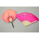 TWO PINK FEATHER FANS, one with pierced staves and one fixed hand fan