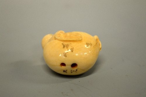 A JAPANESE IVORY NETSUKE, carved in the form of a bird relaxing in an egg, signed to base - Image 4 of 4