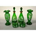 A PAIR OF MARY GREGORY STYLE ENAMEL GREEN GLASS VASES, frilled rims, painted decoration showing a
