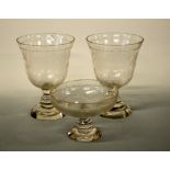 A PAIR OF 19TH CENTURY ENGRAVED BELL SHAPED VASES, together with a similar glass Tazza,