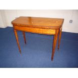 A SATIN BIRCH FOLDING CARD TABLE, with string inlay on tapering square legs with spade feet, beize