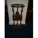 A MAHOGANY WIGSTAND, with two short central drawers on cabriole tripod base, with turned supports,