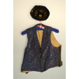 A WAISTCOAT AND HAT, the velvet and embroidered waistcoat, together with a black velvet and