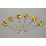 A SET OF SIX VICTORIAN SILVER GILT PUNCH LADLES, twisted handles, Birmingham 1870, by Elkington & Co