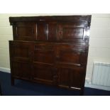 A WELSH COUNTRY OAK DEUDDARN, with carved top rail with scroll and urn design and IBM 1702, over