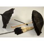 THREE LADIES BLACK GROUND PARASOLS, two with lace overlay, one split handle (all fabric a/f)