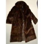 A FUR COAT, of long length, approximate size 12