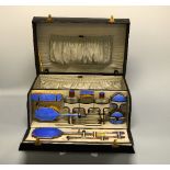 AN INTER-WAR PERIOD FITTED LEATHER VANITY CASE, c.1935, the black stitched leather with gilt/brass