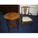 A CIRCULAR ROSEWOOD OCCASIONAL TABLE, with string and musical instrument central inlay on shaped