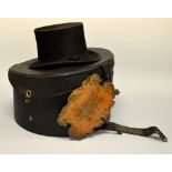 FOUR VINTAGE ITEMS, to include two ladies hats, a top hat and a wooden fan within a large hat box (