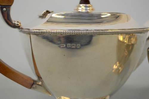 A TWO PIECE SILVER TEASET, Birmingham 1920, approximately weight 875g includes wooden handle and - Image 2 of 3