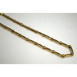 A 9CT GOLD BI-METAL COLOURED NECKLACE, of abstract design, length 45cm, stamped 375, approximately