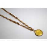 A 9CT GOLD NECKLACE, with fancy chain and coin pendant, length 60cm, total weight approximately 34