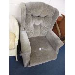 AN UPHOLSTERED ELECTRIC RECLINING ARMCHAIR