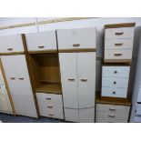 A THREE PIECE BEDROOM FITMENT, including two two door wardrobes and three various three drawer