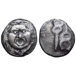 Etruria, Populonia AR 20 Asses. 3rd century BC. Facing head of Metus, tongue protruding, hair