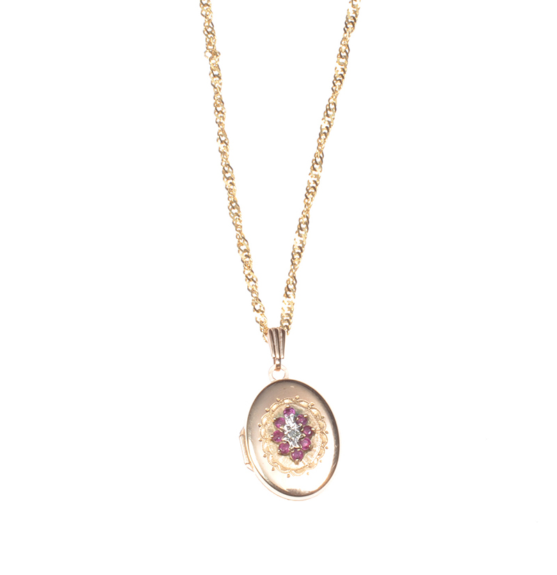 9 CT GOLD ENGRAVED RUBY & DIAMOND OVAL LOCKET ON A FINE 9 CT GOLD CHAIN
