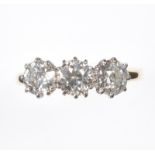 18 CT GOLD THREE STONE DIAMOND RING