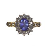 18 CT GOLD TANZANITE AND DIAMOND RING