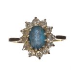 9 CT GOLD BLUE STONE AND DIAMANTÉ CLUSTER RING