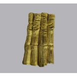 An 18ct gold brooch pendant, Sheffield 1979, maker A.C.S, formed as a cluster of bamboo, approx