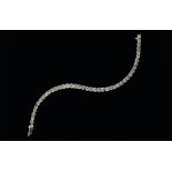 An 18ct white gold and diamond set line bracelet, forty-two round brilliant cut diamonds, approx 8.