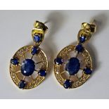 A pair of sapphire and diamond drop earrings, the unmarked yellow metal testing as 18ct, each set