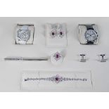 An 18ct white gold, diamond and ruby set presentation parure, consisting of bracelet, ring,