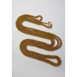 A 15ct gold long-chain, each link with looped flower head design, approx 154cm, approx 92.3g.