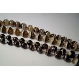 A graduated banded agate bead necklace, approx 53cm, together with another similar, approx 40.