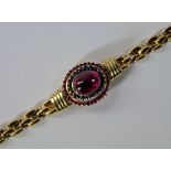 A 14ct gold, rubellite, sapphire and ruby set bracelet, the tiered central plaque set with an oval