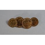 A pair of gold gentleman's cufflinks, fashioned as full and half sovereigns, probably 9ct gold,