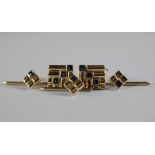 A pair of 18ct gold and sapphire set gentleman's cufflinks, of square ribbed form, set diagonally