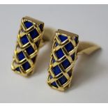 A pair of 18ct gold and lapis lazuli gentleman's cufflinks, of lattice form, enclosing a semi