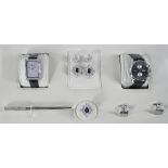 An 18ct white gold, diamond and sapphire set presentation parure, consisting of ring and pendant