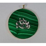 A gold mounted and diamond set malachite pendant, of circular form, the white metal and diamond