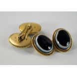 A pair of 18ct gold and agate set gentleman's cufflinks, of oval form, the mount with rope twist