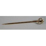 An old cut diamond set stick pin, in the form of a horseshoe, cased. CONDITION REPORT: Good